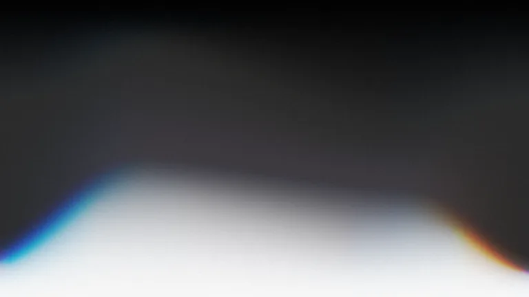 Carbon Veil: A deep graphite field opening into a soft white horizon.