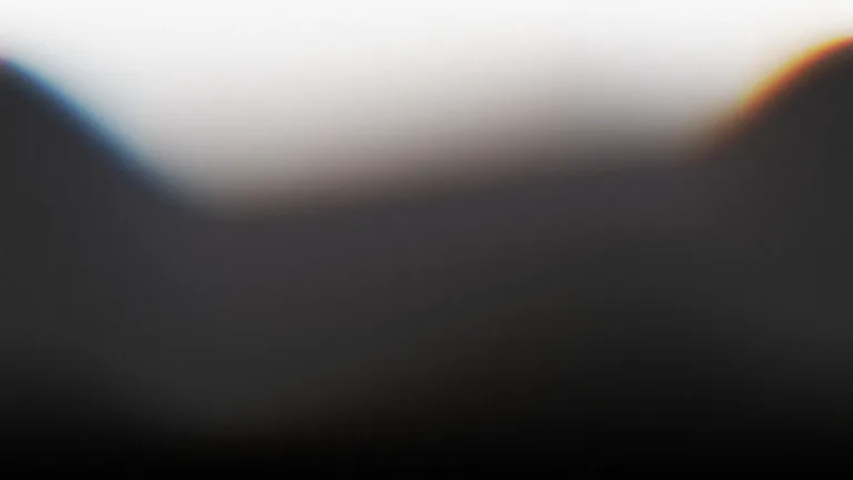 Graphite Rise: A deep graphite field opening into a soft white horizon.