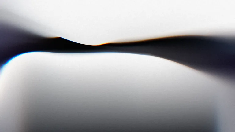 Soft Chrome: Silver folds around an ink-blue seam, edged with spectral light.